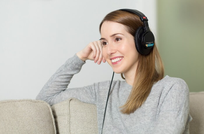 An host listening to an Airbnb podcast